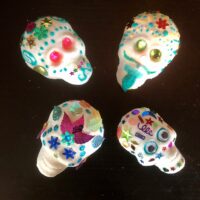 Four decorated sugar skulls