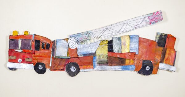 A red firetruck with a white ladder made of fabric sewn together.